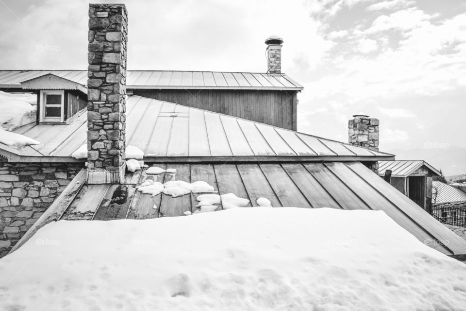 Snowy Roof Cabin In Winter
