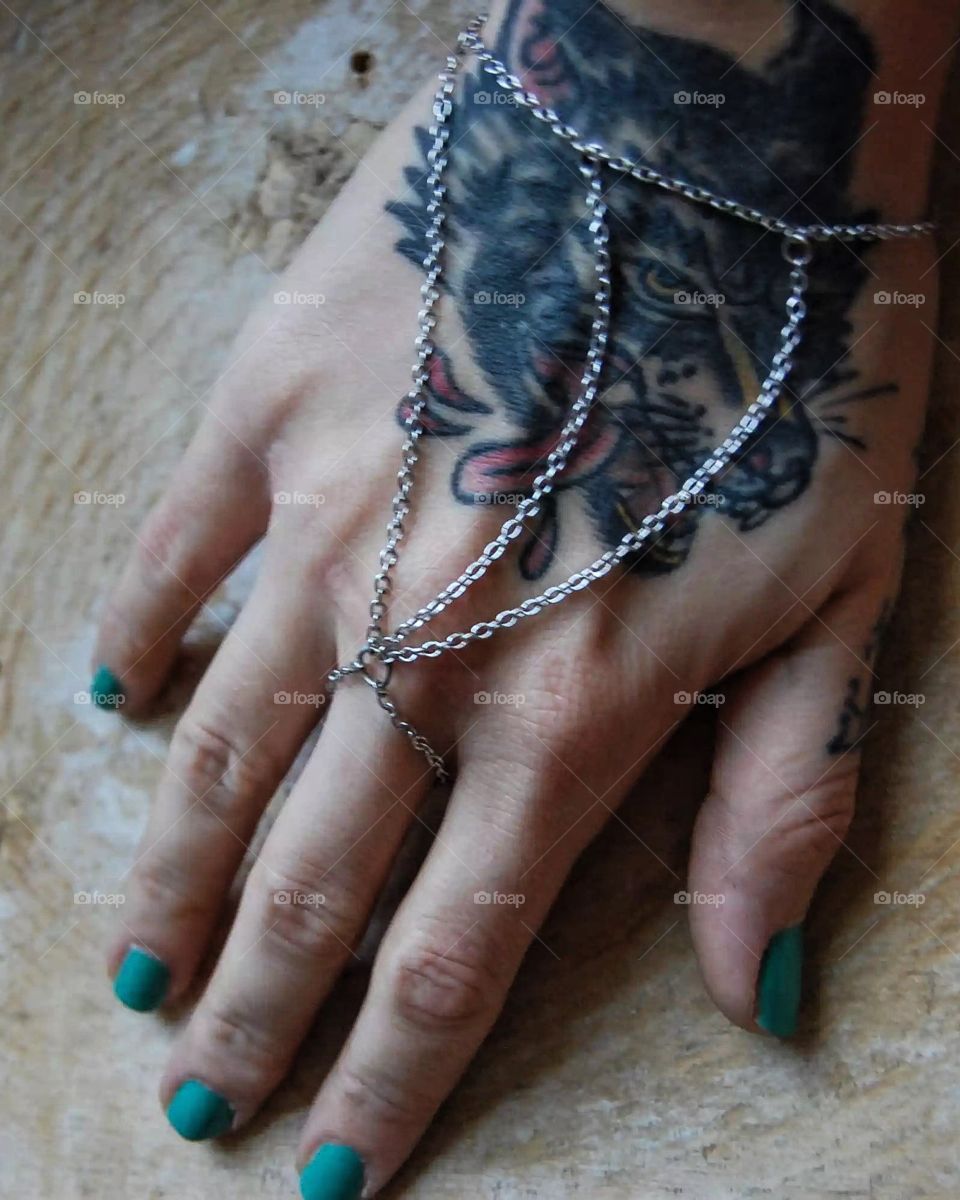 Gauntlet hand jewelry on the hands that made it. 