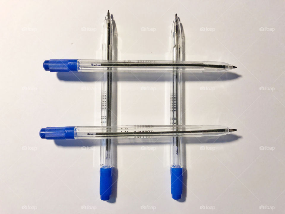 blue pens on white background