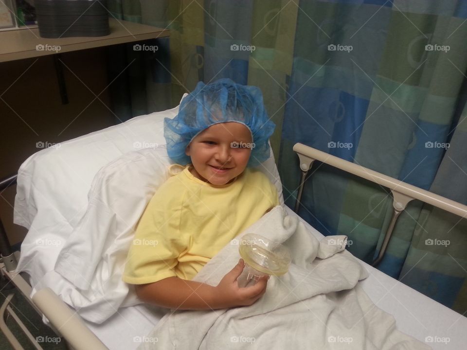 My brave little man getting ready to go back for surgery. He was so scared but he was so brave and put on a smile even with his nerves so on edge!!