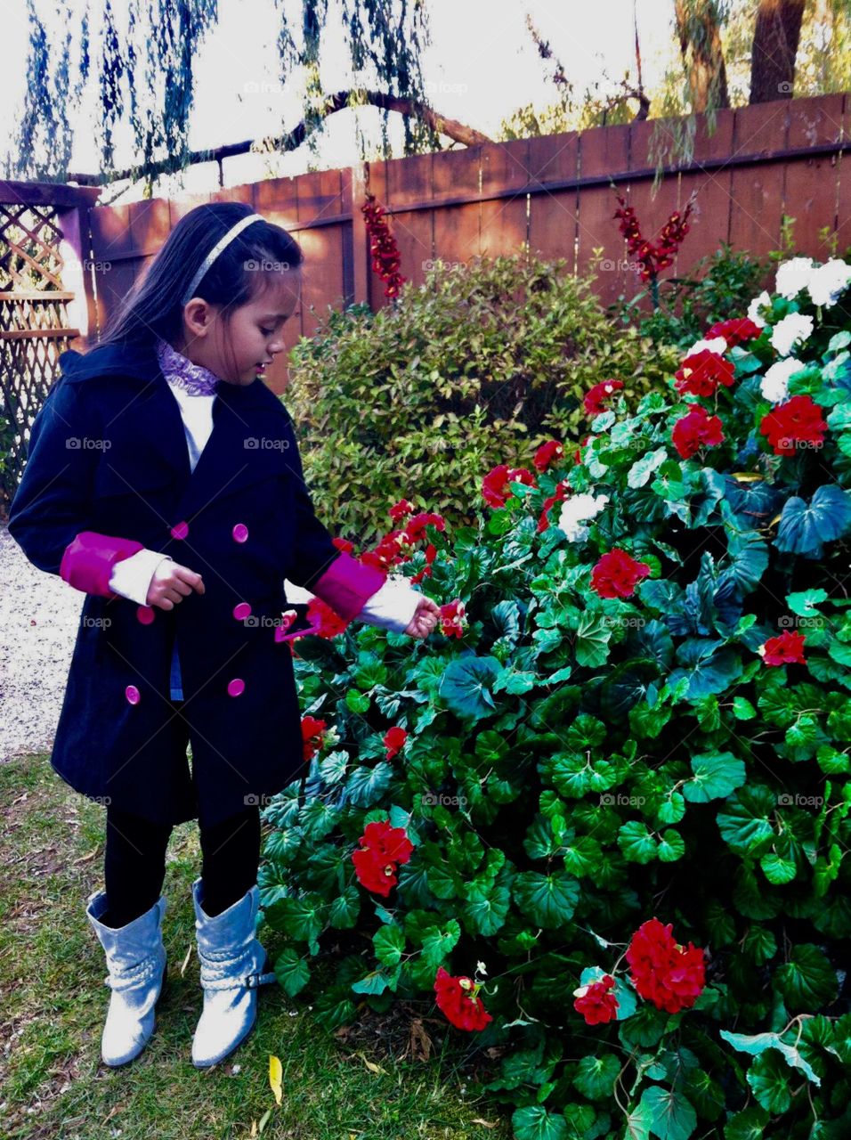 A little girl and a garden