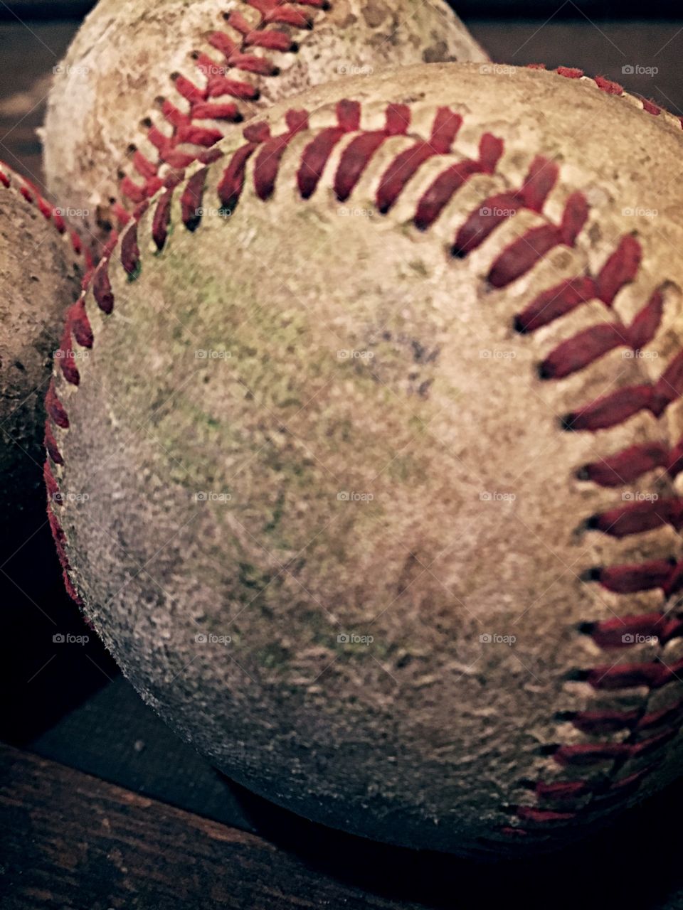 Worn, used baseballs. 