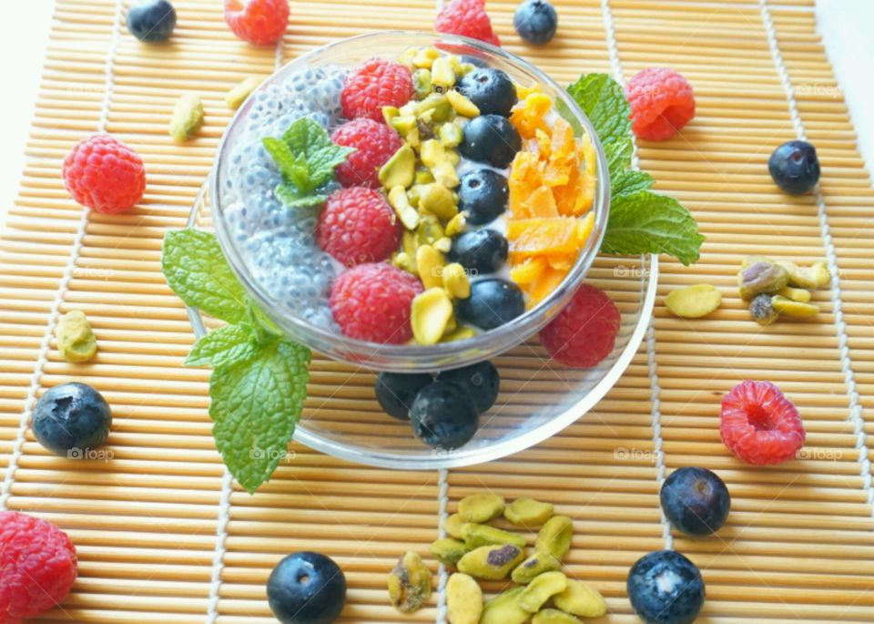 Smoothie Fresh Fruits Bowl - raspberry, blueberry,  mango, nuts and basil seeds