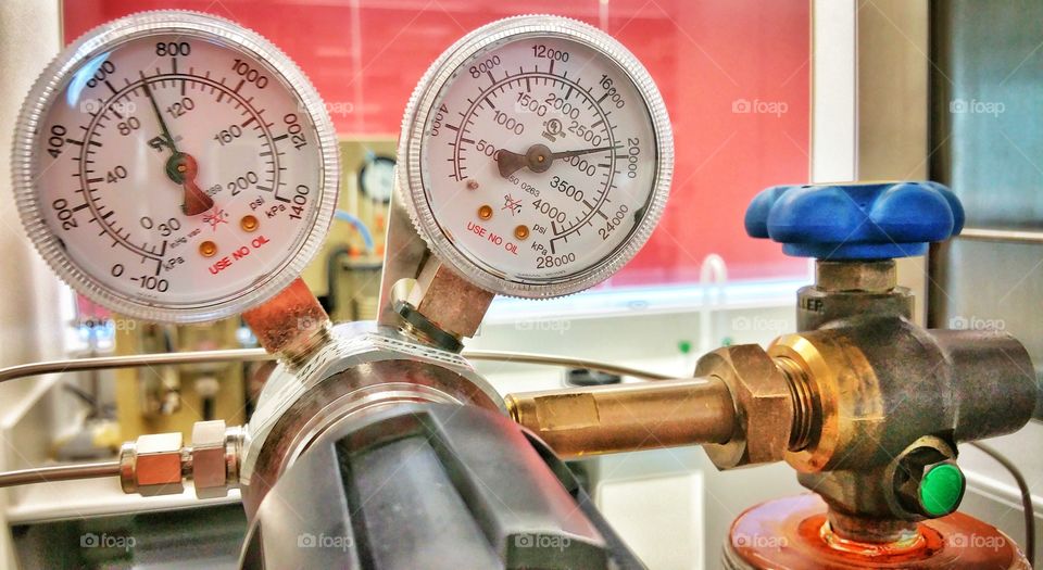 Gas pressure gauges on a cylinder regulator.