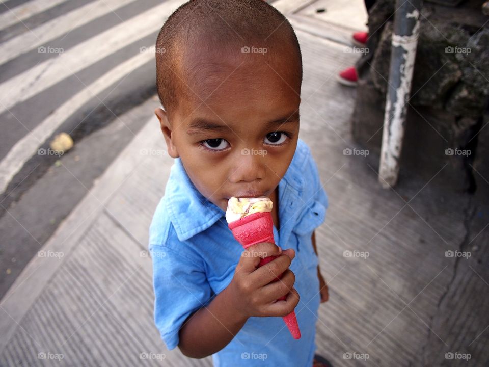 young boy eating ice cream