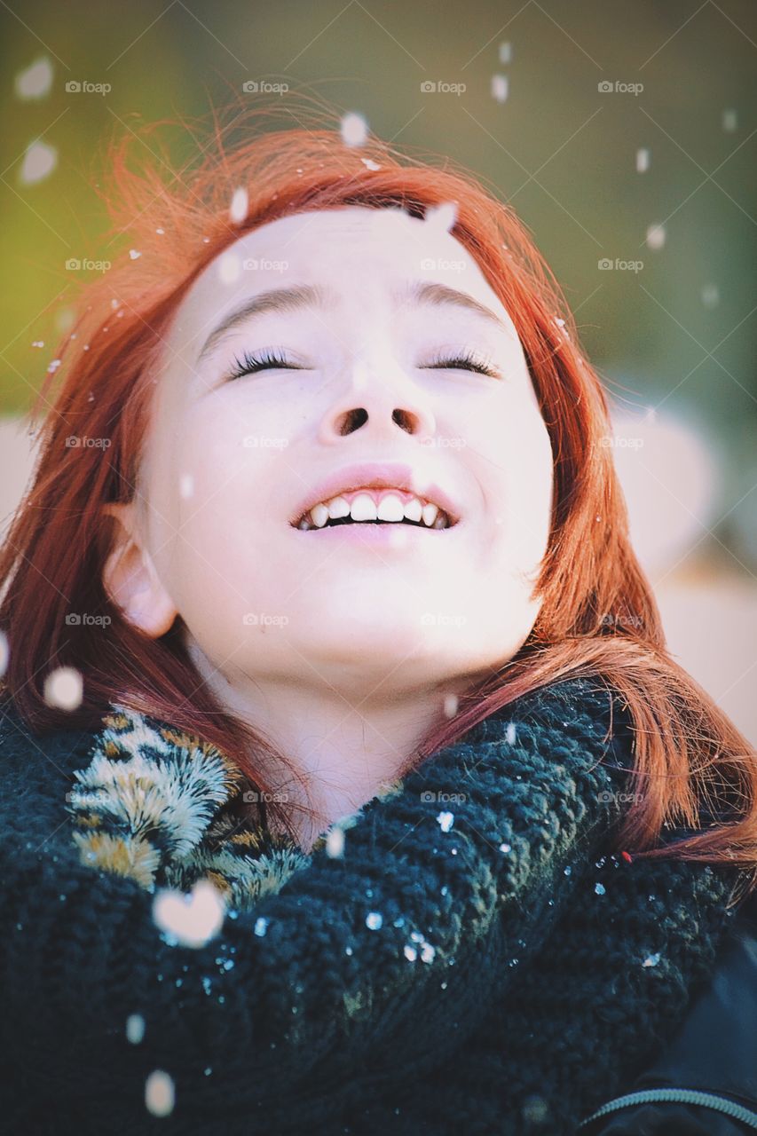 Close-up of a girl during blizzard