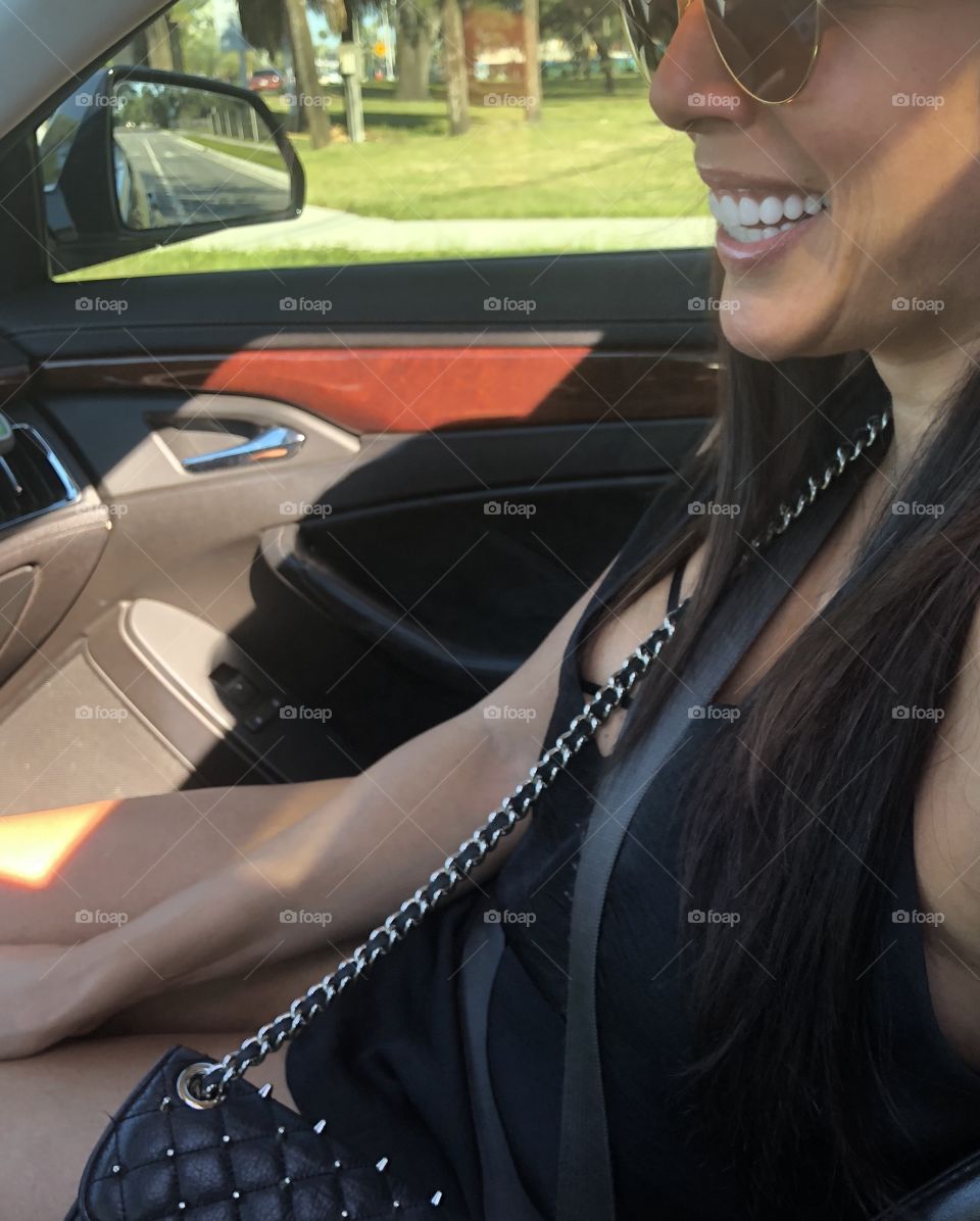 Girl in car smiling