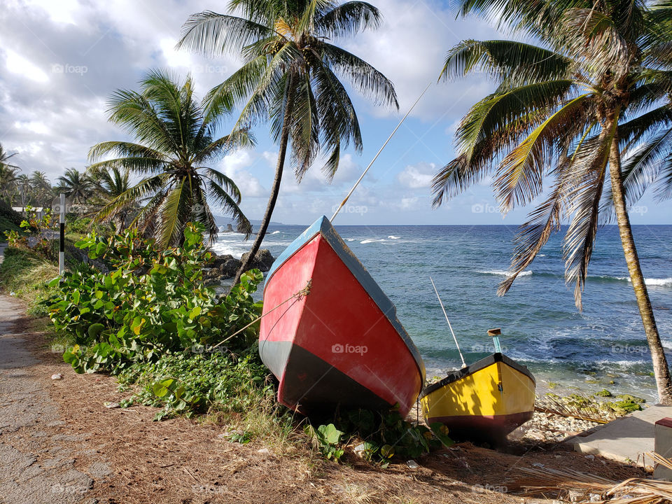 Two boats on the shoreline of Bathsheba Barbados