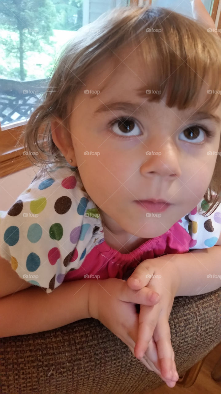 Close-up of a little girl with praying hands