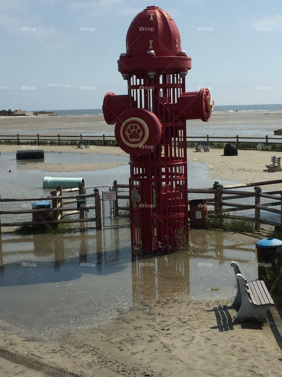 Giant fire hydrant on the beach