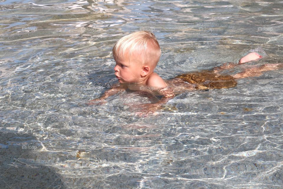 Blond boy playing 