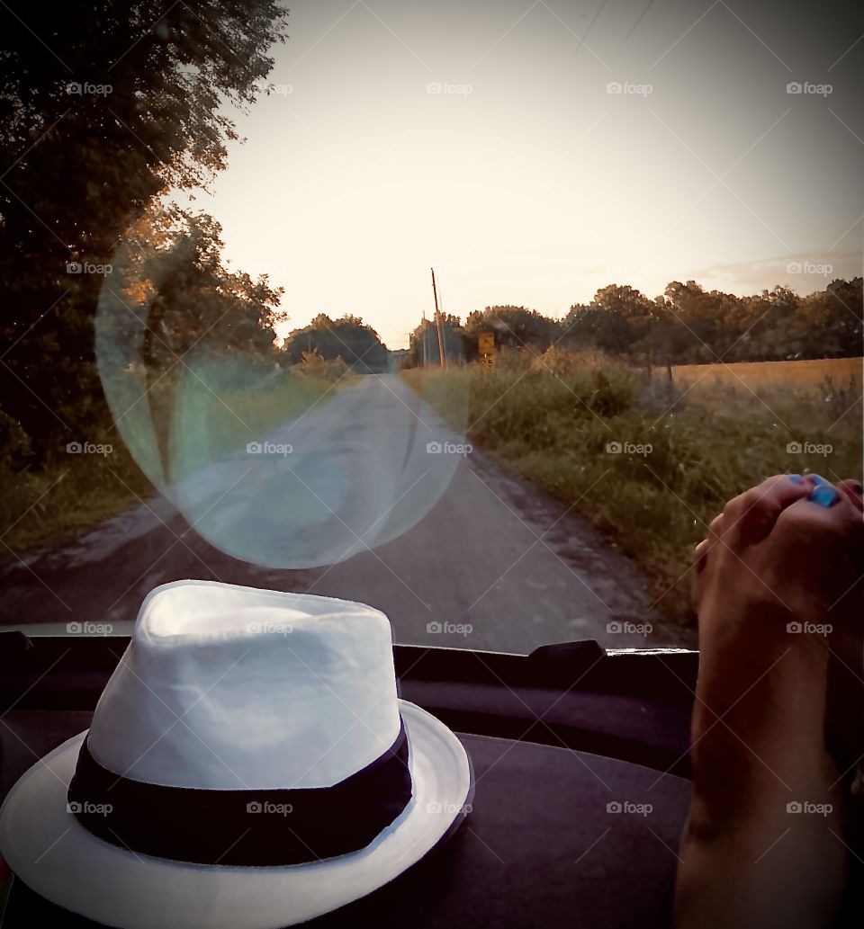 A blues musician and his lady strolling down a beautiful country road side just peace and Harmony. Comfortable cruise feet up and no worries just harmony of the life I am enjoying. Picked up a turtle along the way