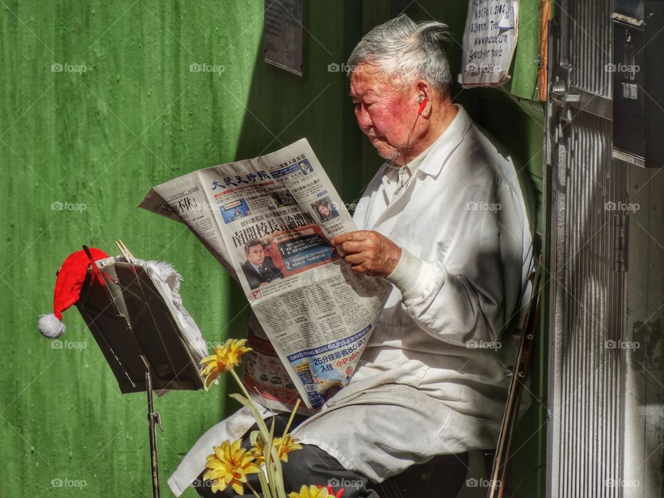 Old Man Reading A Newspaper
