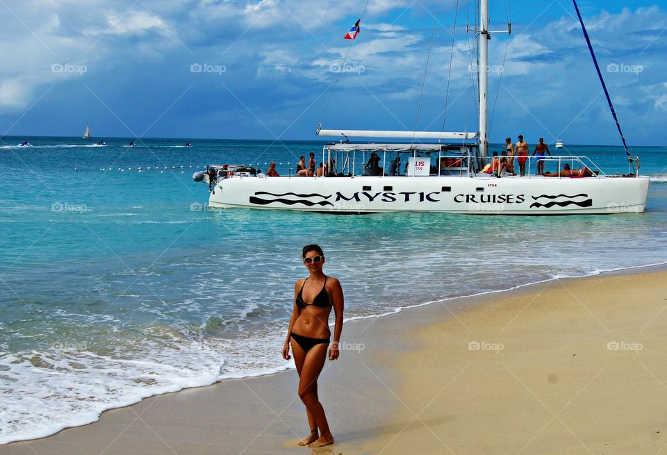 Woman posing at beach in bikini