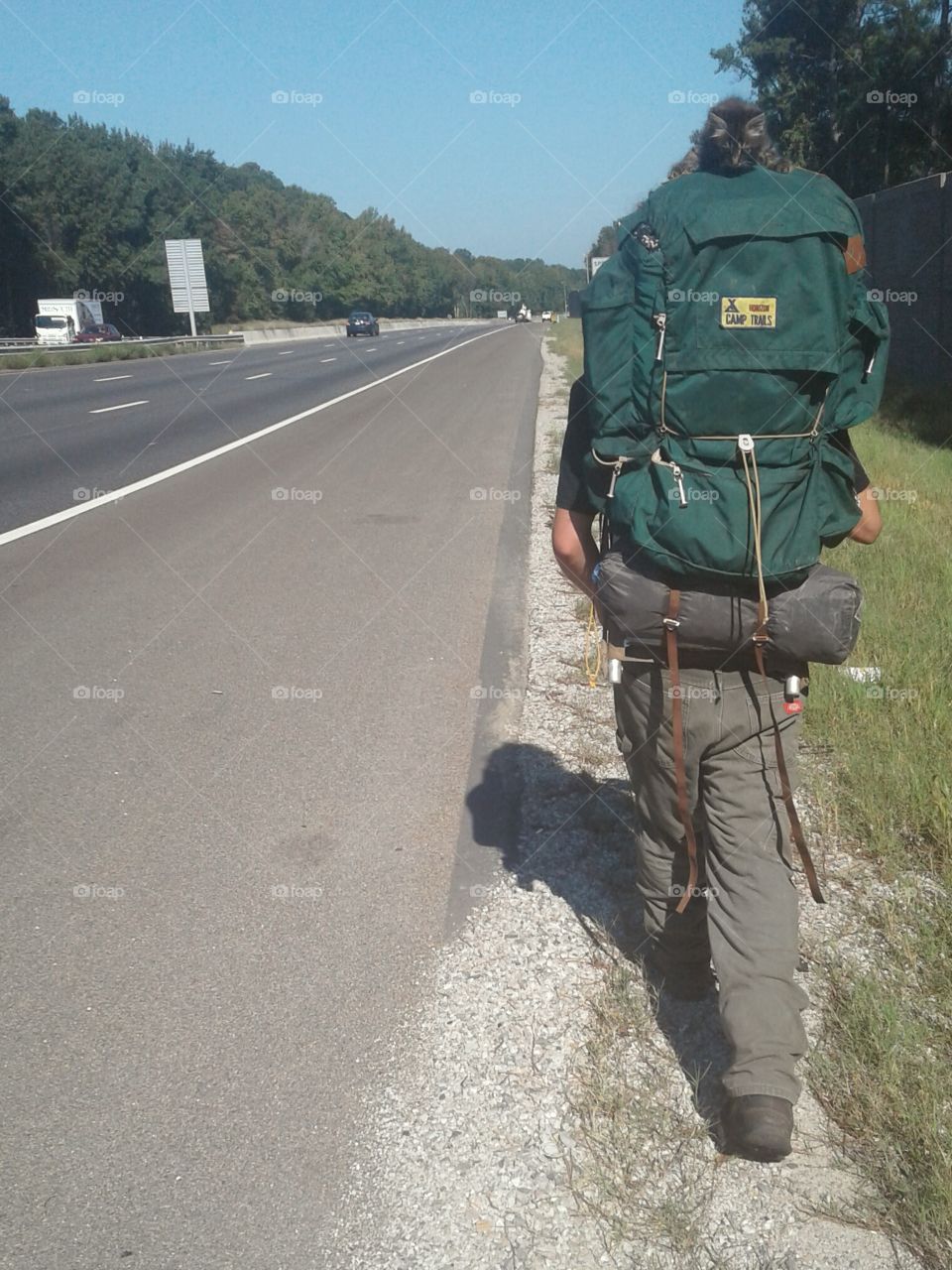 Traveler walking on the interstate.