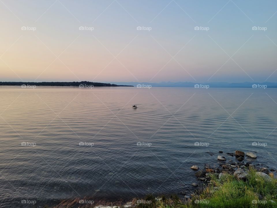 Couple Boating at Beach Sunset