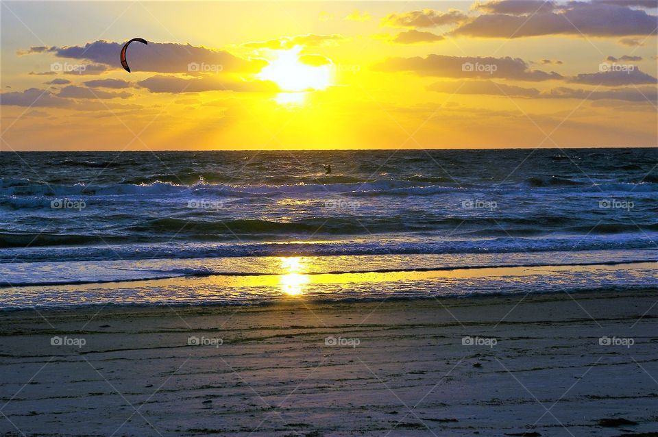 Kiteboarding At Sunset 