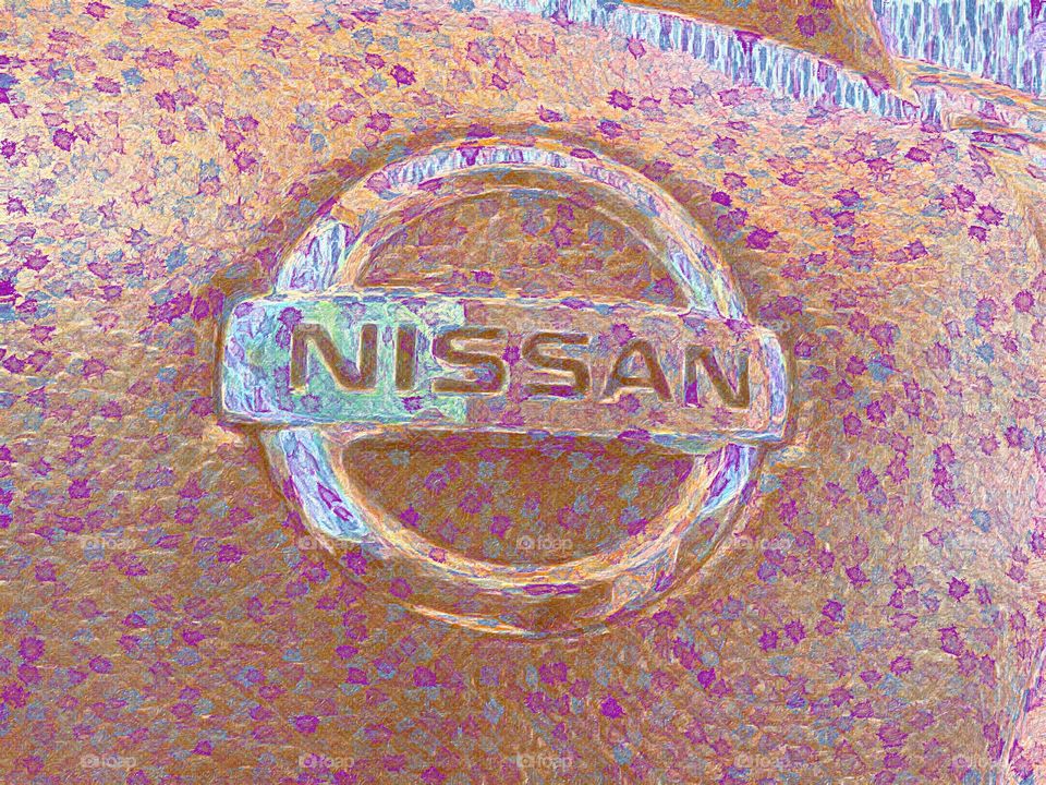 Nissan emblem. This picture was enhanced with a camera filter from brush stroke iPhone app which makes photographs look like paintings.