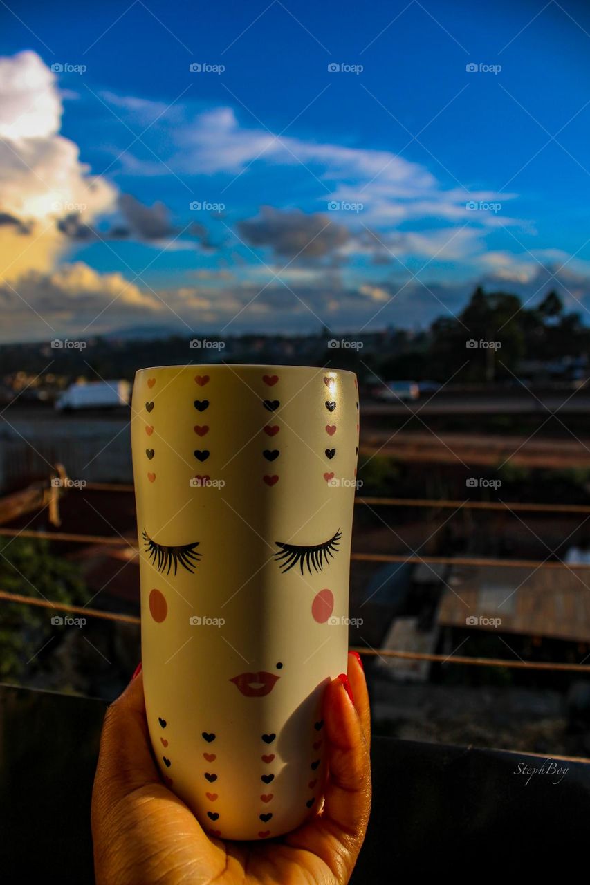 Drinking from a cute mug enjoying the views 