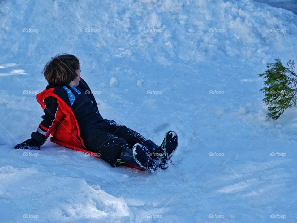 Boy Playing In The Snow