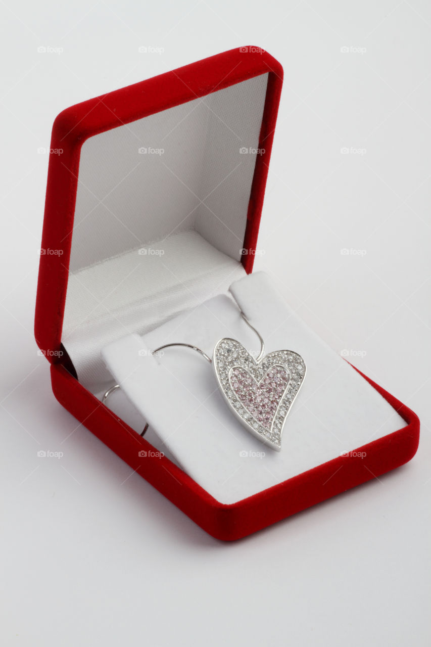 Heart shaped pendant with silver chain in a box