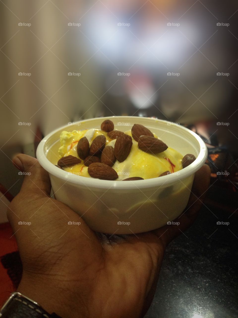 Almonds and ice cream in bowl