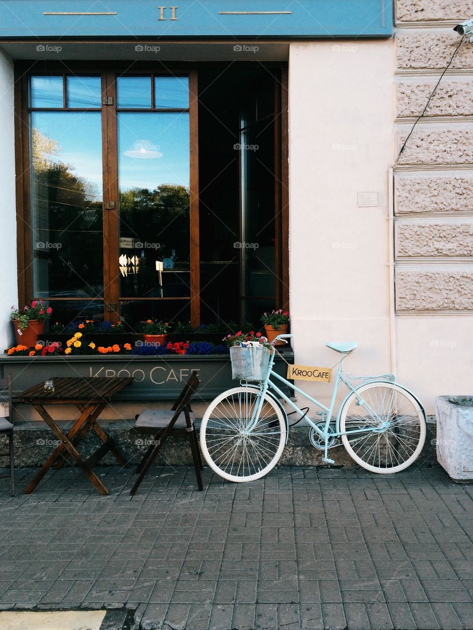 One lonely blue bicycle on the street 