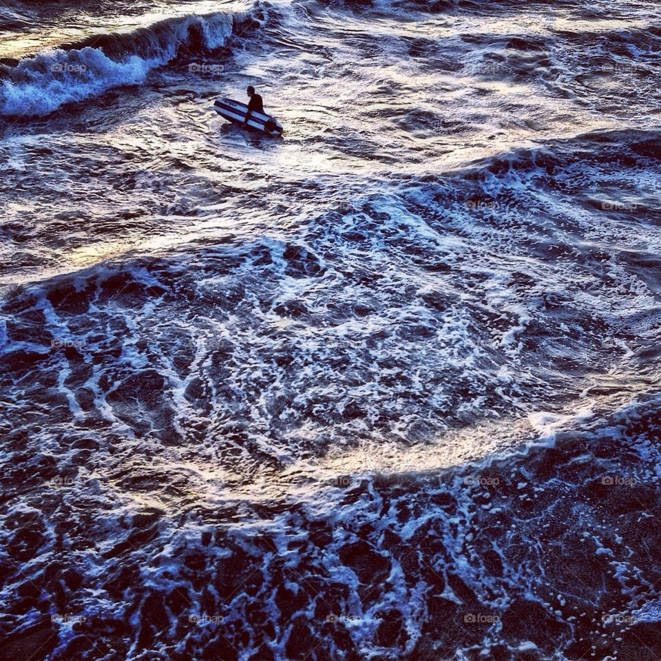 sunset waves surfer venice beach by jayanta