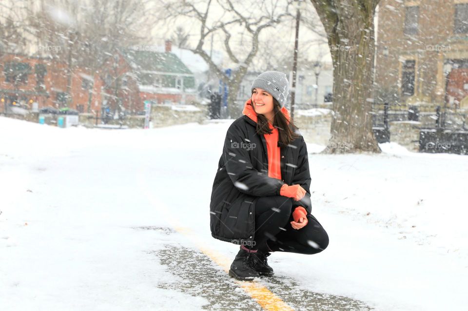 Girl in snow falling