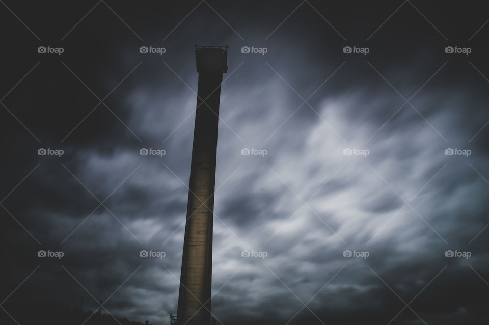 dramatic clouds with a chimney