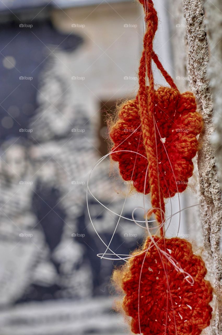 Orange flower woven from wool. Badge of the struggle for the memory in Argentina.