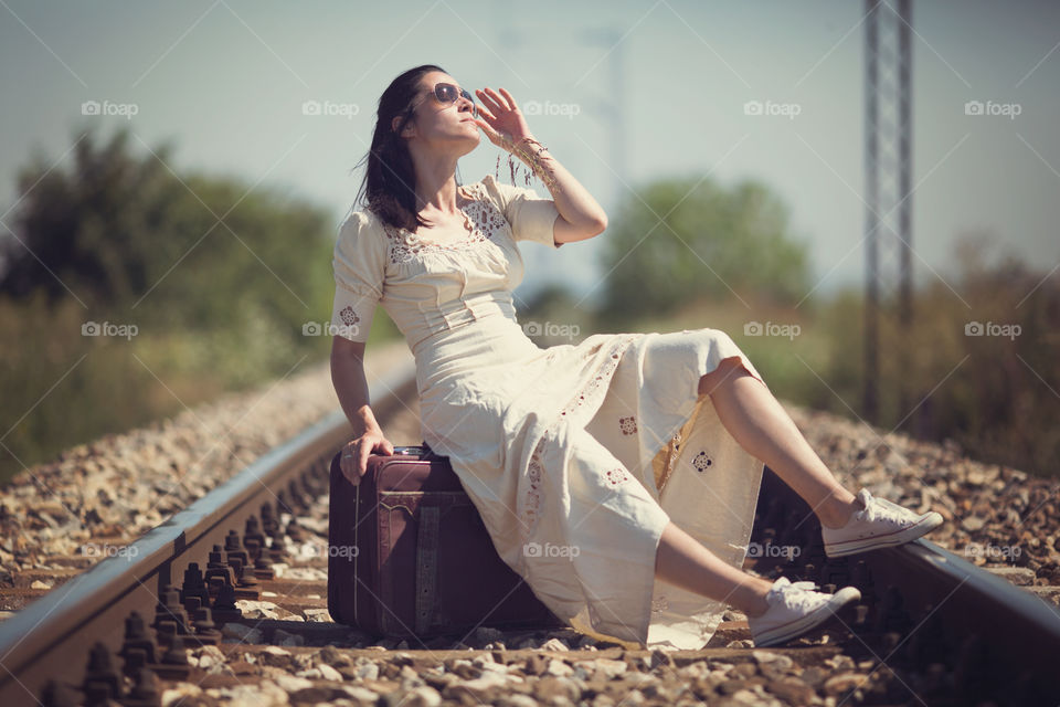 Woman with vintage dress and suitcase 