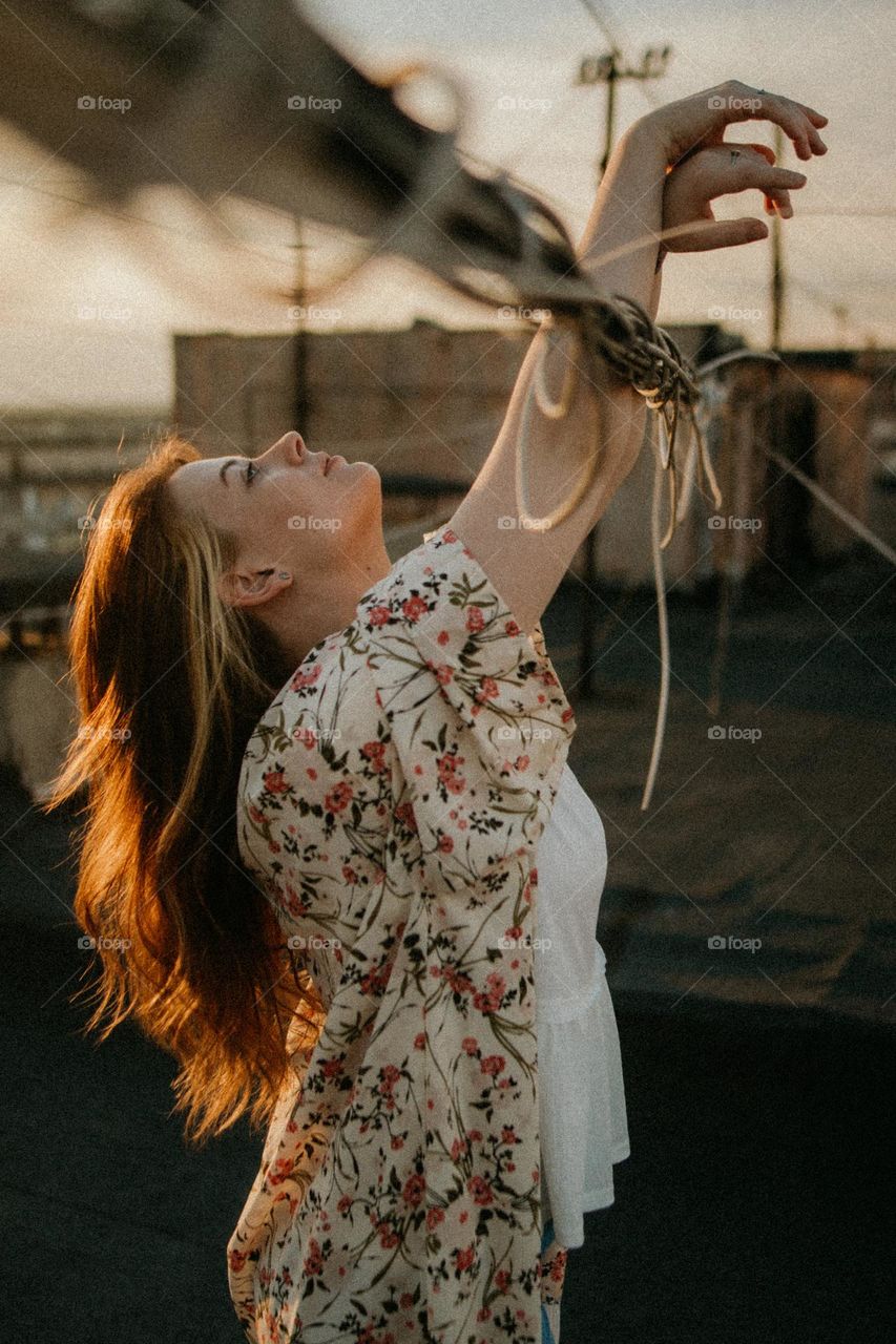 portrait of a beautiful girl at sunset