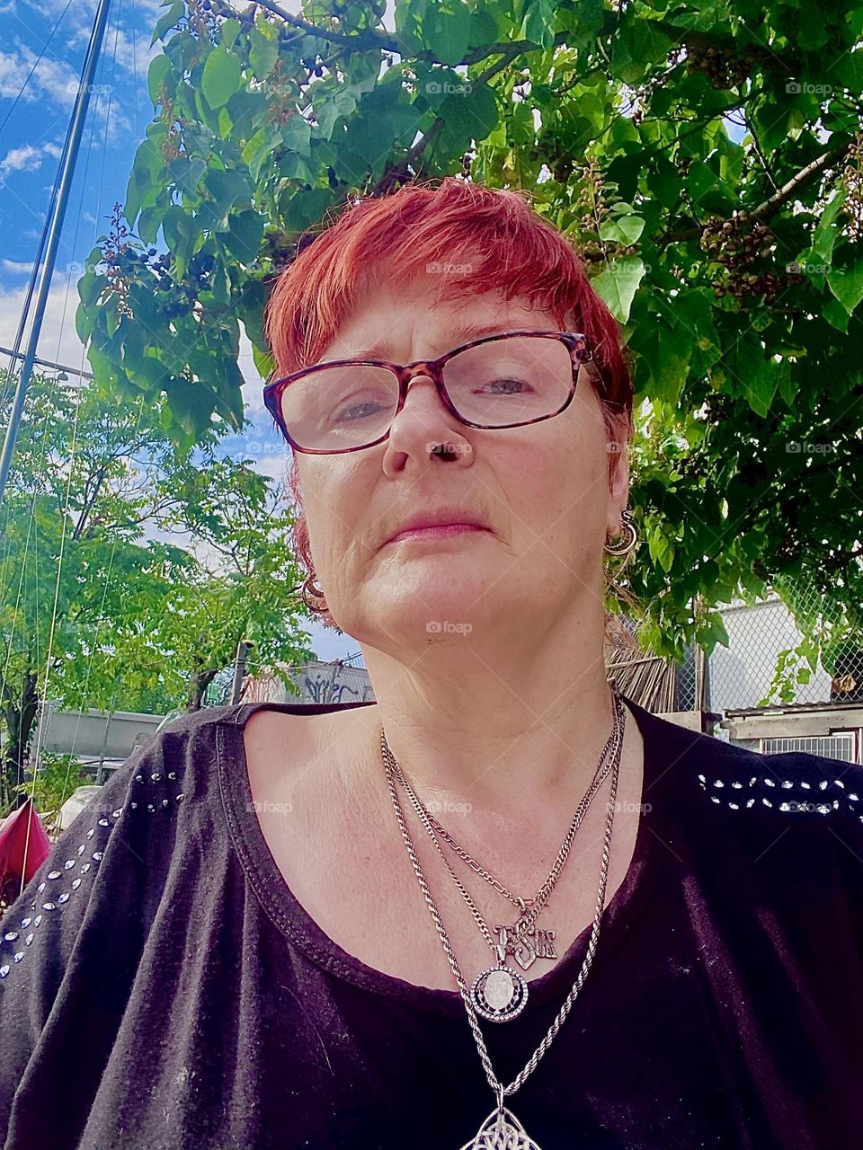 This is me, „Petra Schiller“ a.k.a. „Maxine Firefox“ aboard „Salvation“, our „28 ft 1969 Luhrs“ cabin cruiser that I and my significant other call home enjoying a late summer afternoon at „Newtown Creek“ in LIC, Queens. 2023. Hypnotic Productions