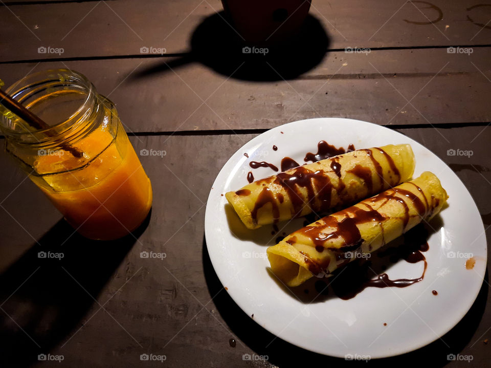Srilankan style pancake with chocolate syrup. yummy and delicious along with fresh juice.