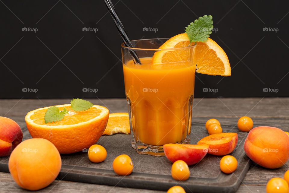 orange juice and black background