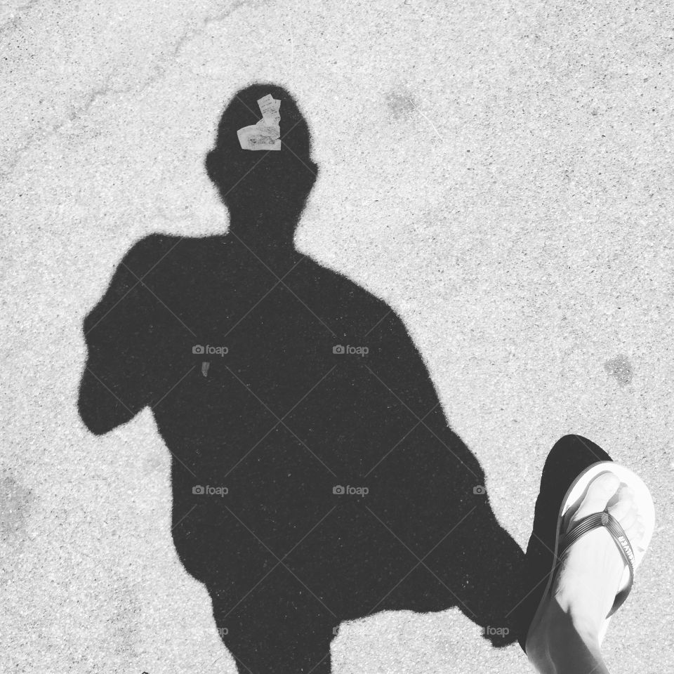 Black and white shadow while walking on street 