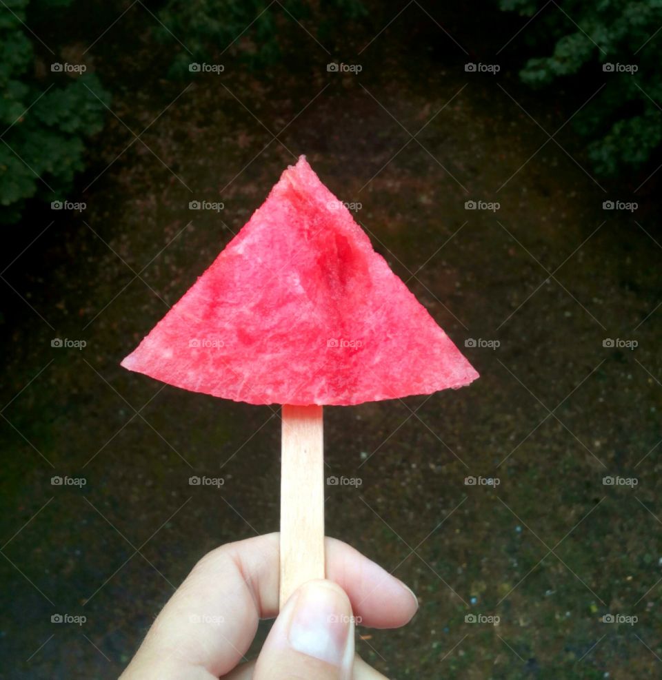 A person holding sweet watermelon