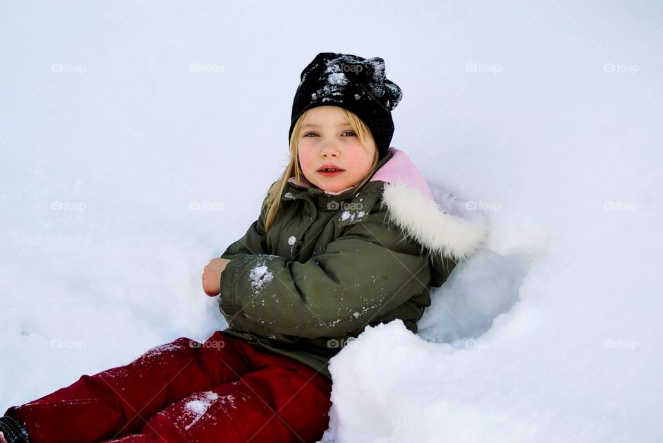 Girl sitting in the snow