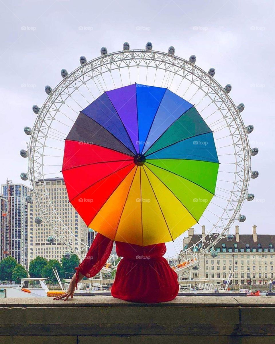 A girl with a colored umbrella in London