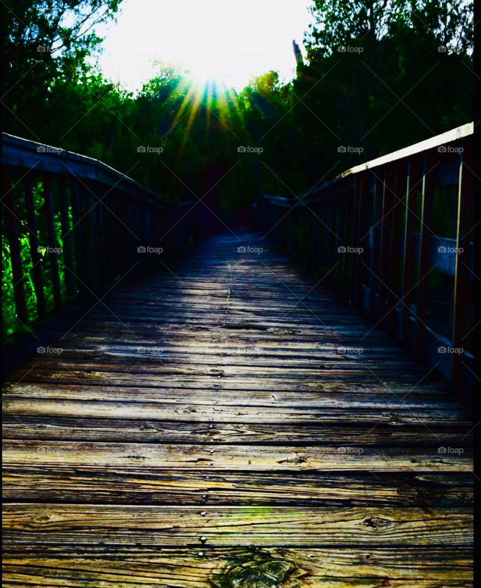 Sunset on an old wooden bridge 