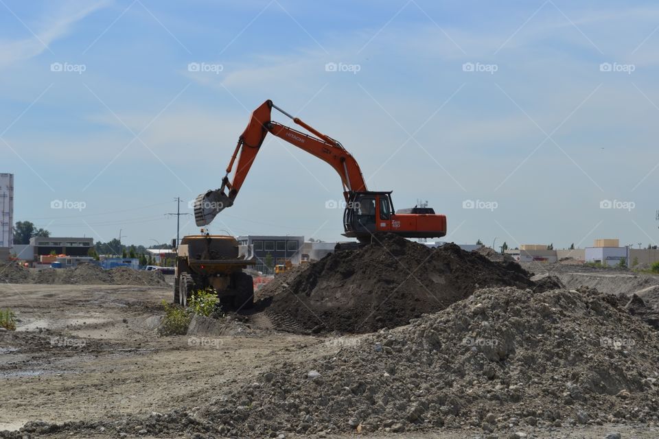 Volvo truck receiving land fill in large land re development project, canada. Volvo truck receiving land fill in large land re development project, canada