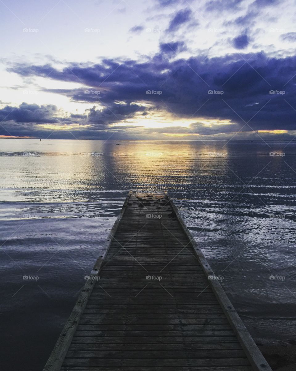 Walking down the pier when the sun goes down 
