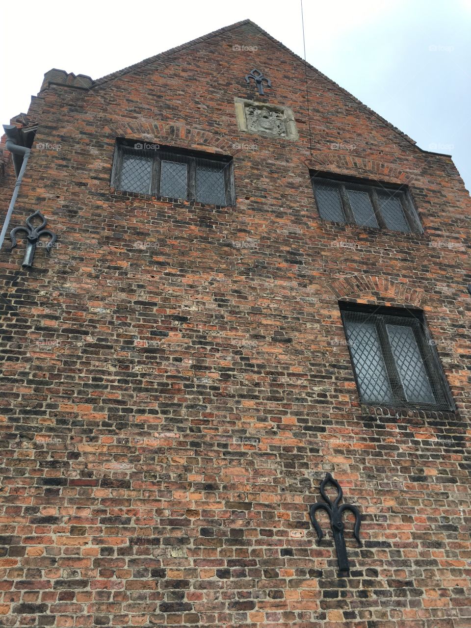 Exterior view of brickwork and windows of the mediaeval Manor House of Gainsborough Old Hall in England