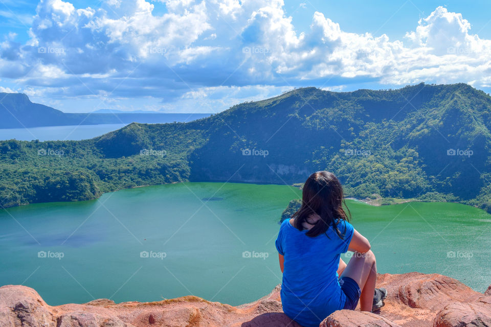 A woman reached a volcano's summit ( rule of thirds, negative space)