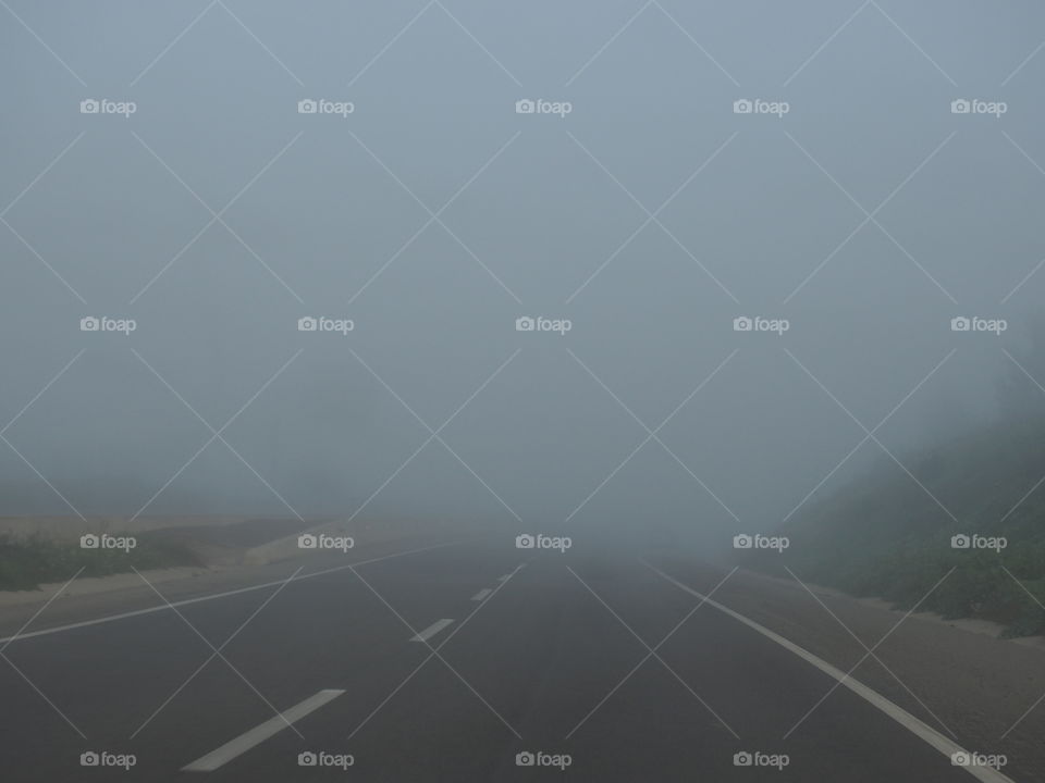 View of foggy road