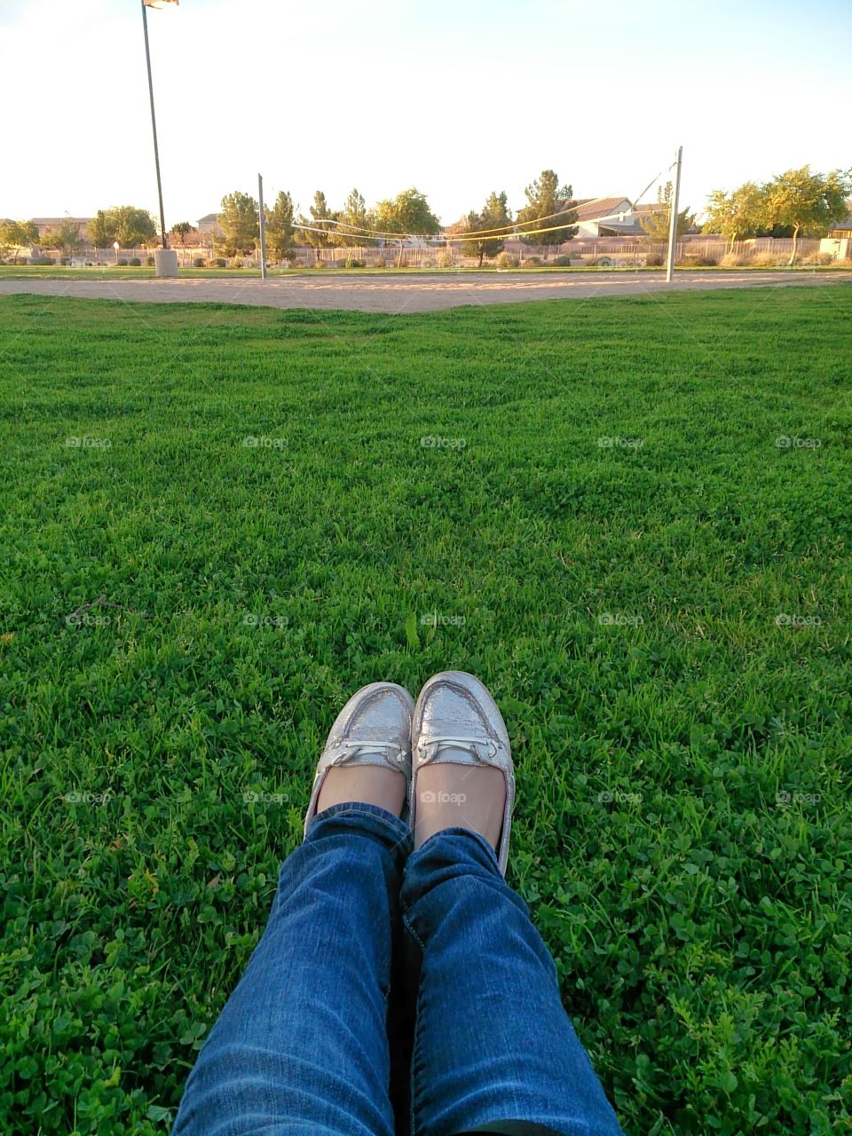 Relaxing at the park. The park in my neighborhood has nice grass