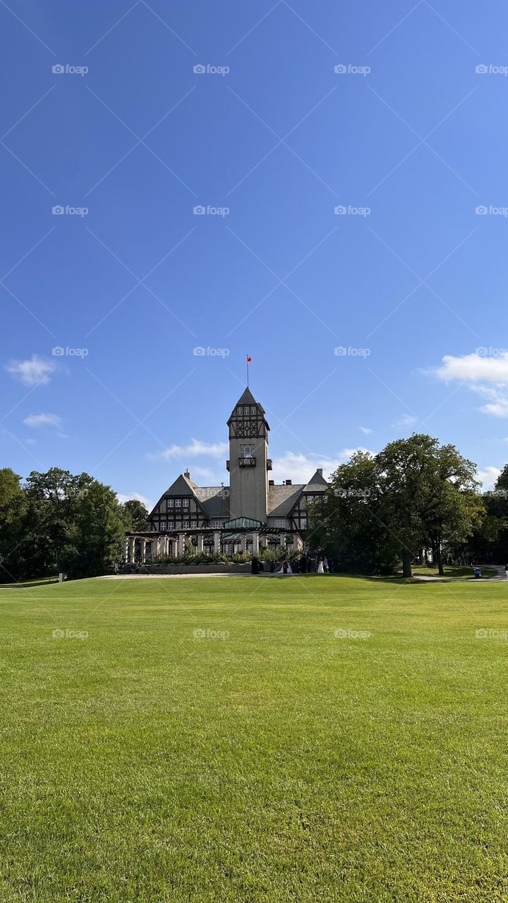 The castle hides inside the garden