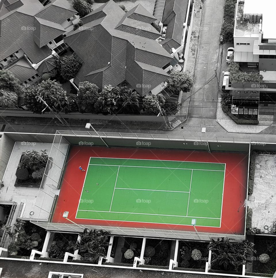 selective color of tennis court view from at a residential condominium