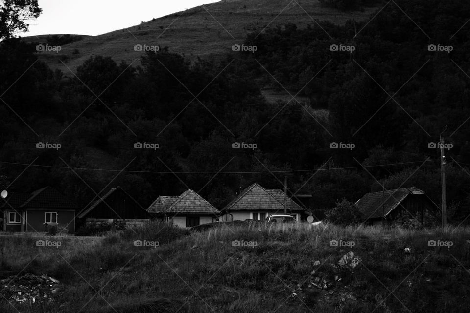 The view over an old village in black and white.